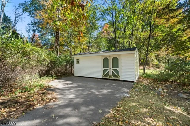 a view of a house with a tree