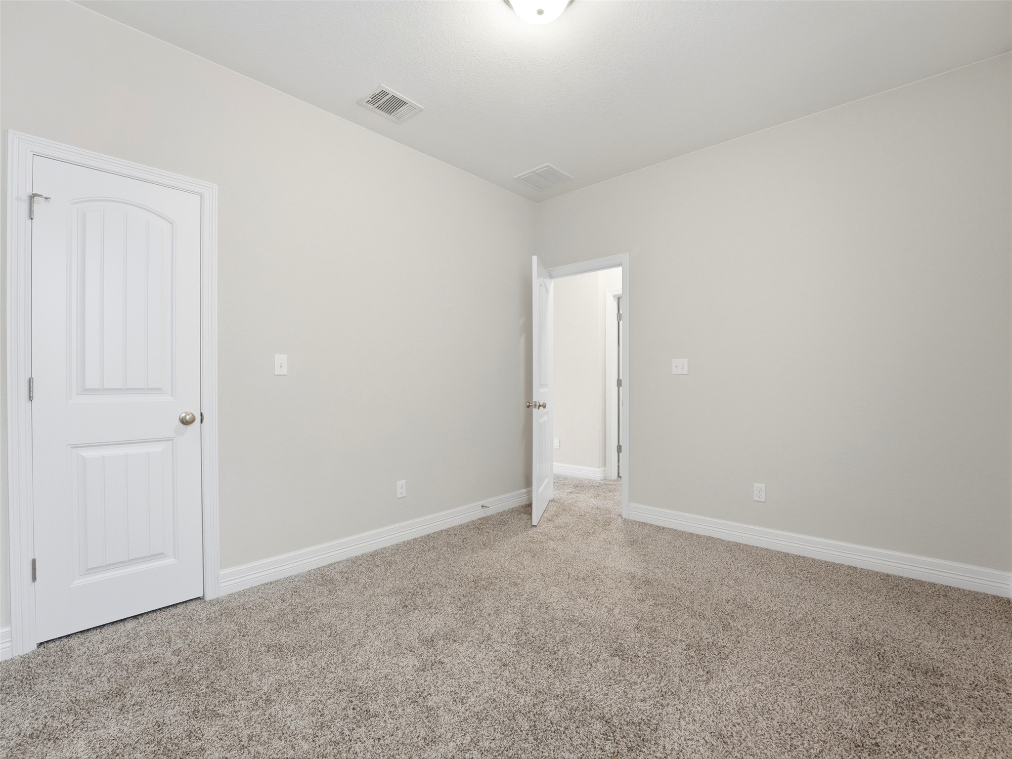 2132 Ringstaff Road Leander, TX 78641 - Photo 28 of 39 An inviting room awaits personalization with plush carpeting and pristine walls.