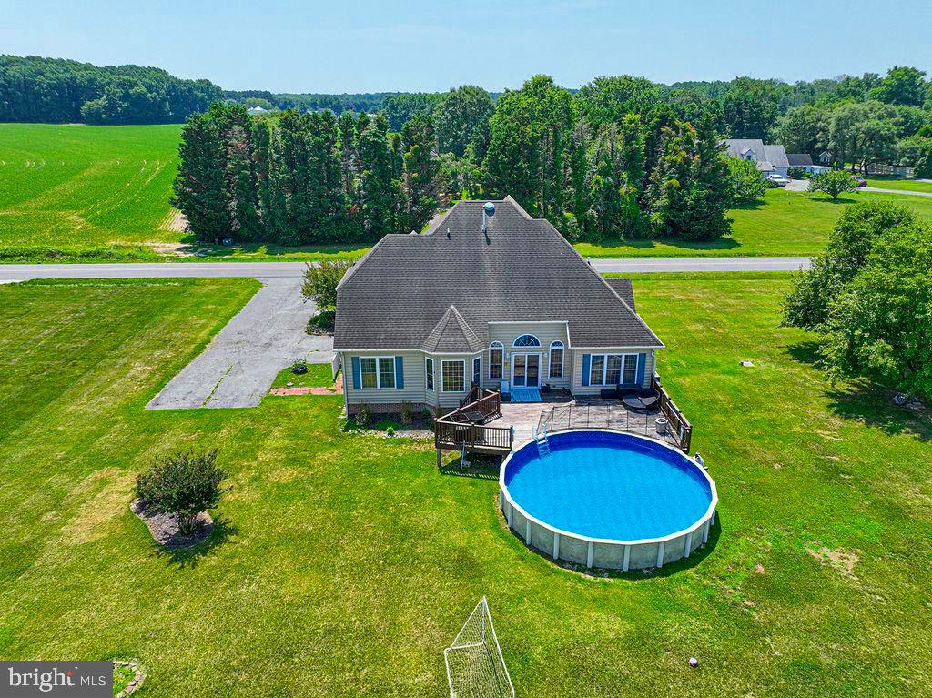 10671 Cathell Road Berlin, MD 21811 - Photo 56 of 63 a aerial view of a house with swimming pool and trees in the background