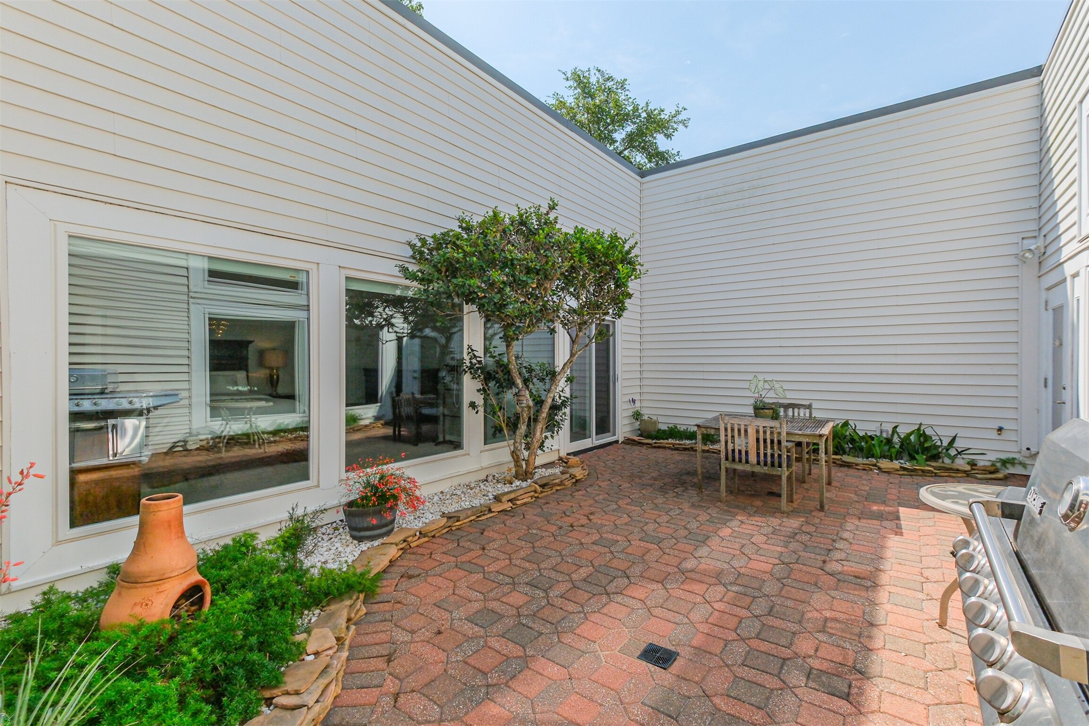 1007 Arrow Hill Road Houston, TX 77077 - Photo 28 of 48 There is plenty of space for a table and chairs and lounge chairs in the courtyard.