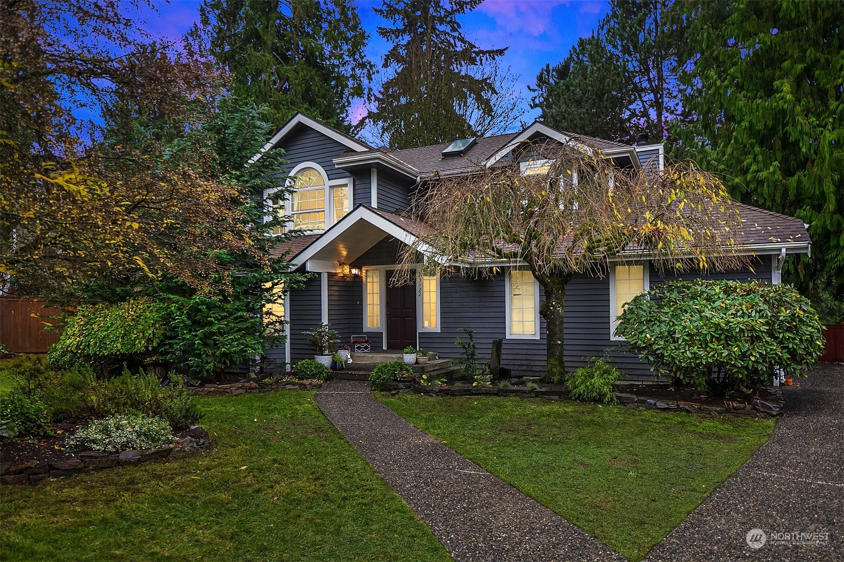 23122 20th Avenue Southeast Bothell, WA 98021 - Photo 1 of 35 a front view of a house with a yard and garage