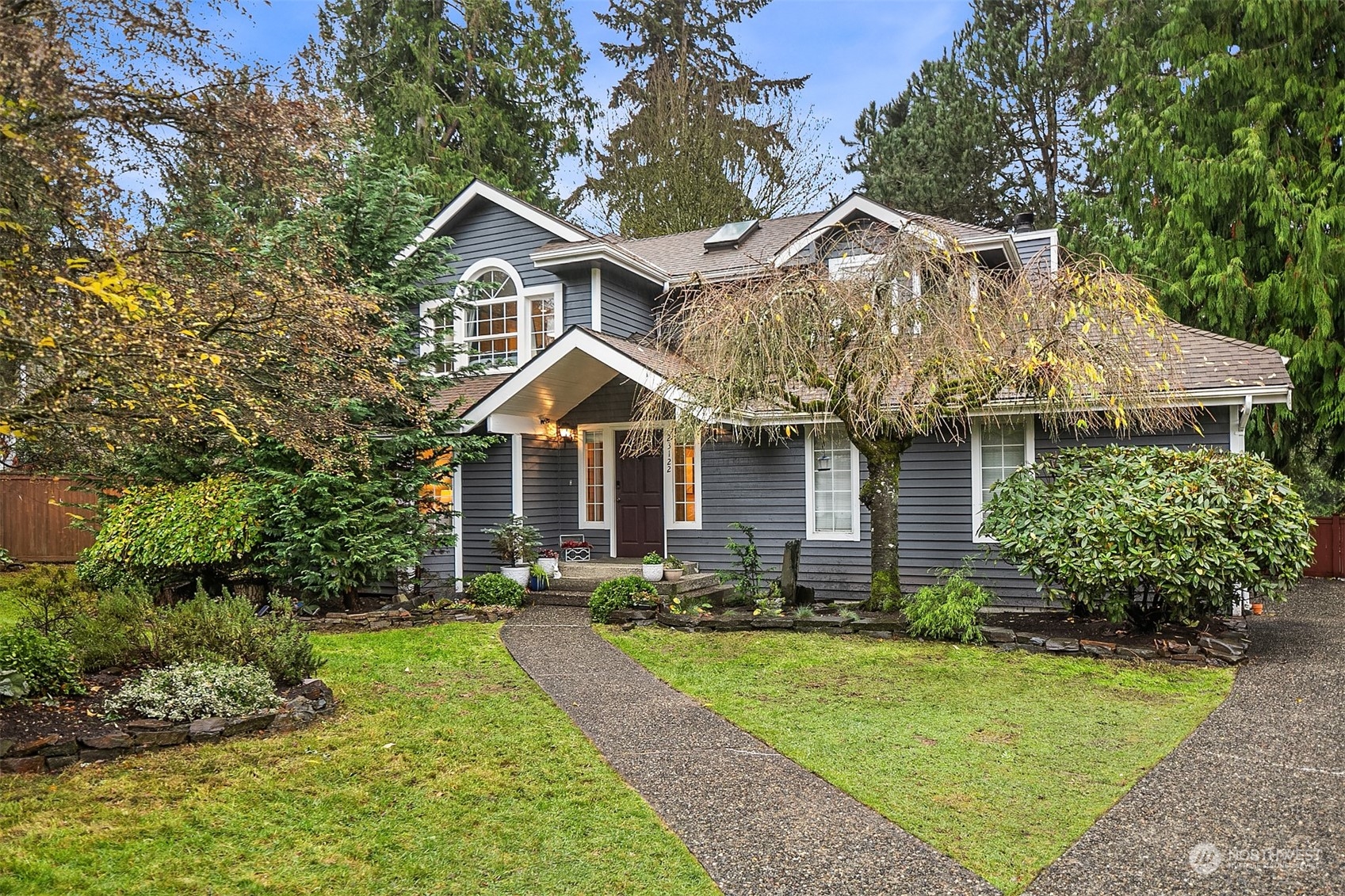 23122 20th Avenue Southeast Bothell, WA 98021 - Photo 3 of 35 a front view of a house with a yard