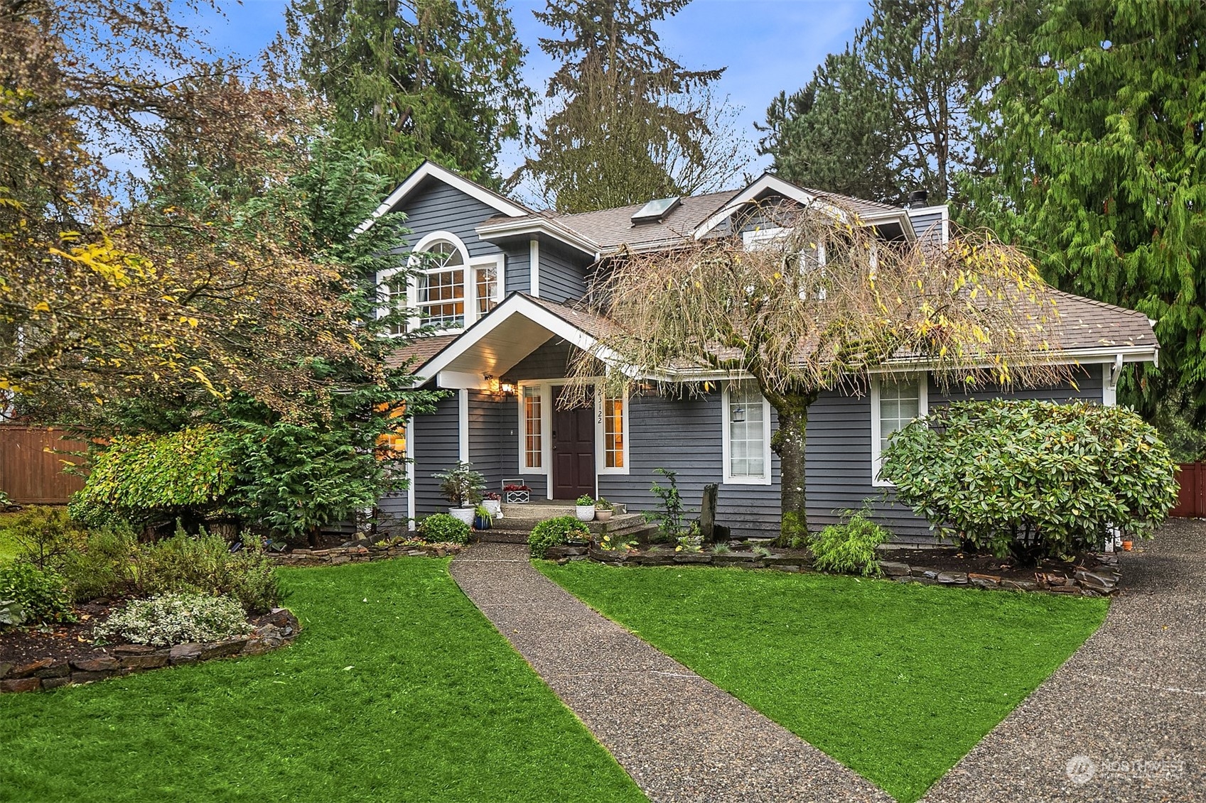 23122 20th Avenue Southeast Bothell, WA 98021 - Photo 4 of 35 a front view of a house with a yard and trees