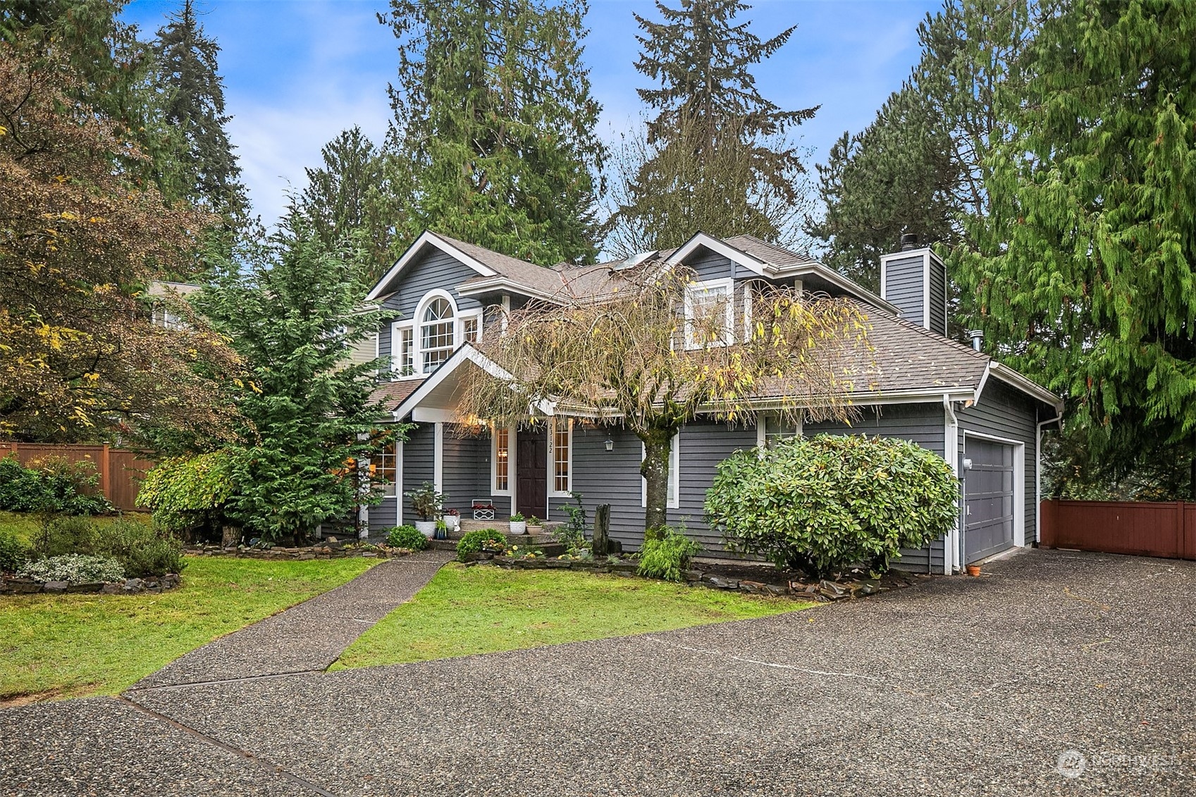 23122 20th Avenue Southeast Bothell, WA 98021 - Photo 5 of 35 a front view of house with yard and green space