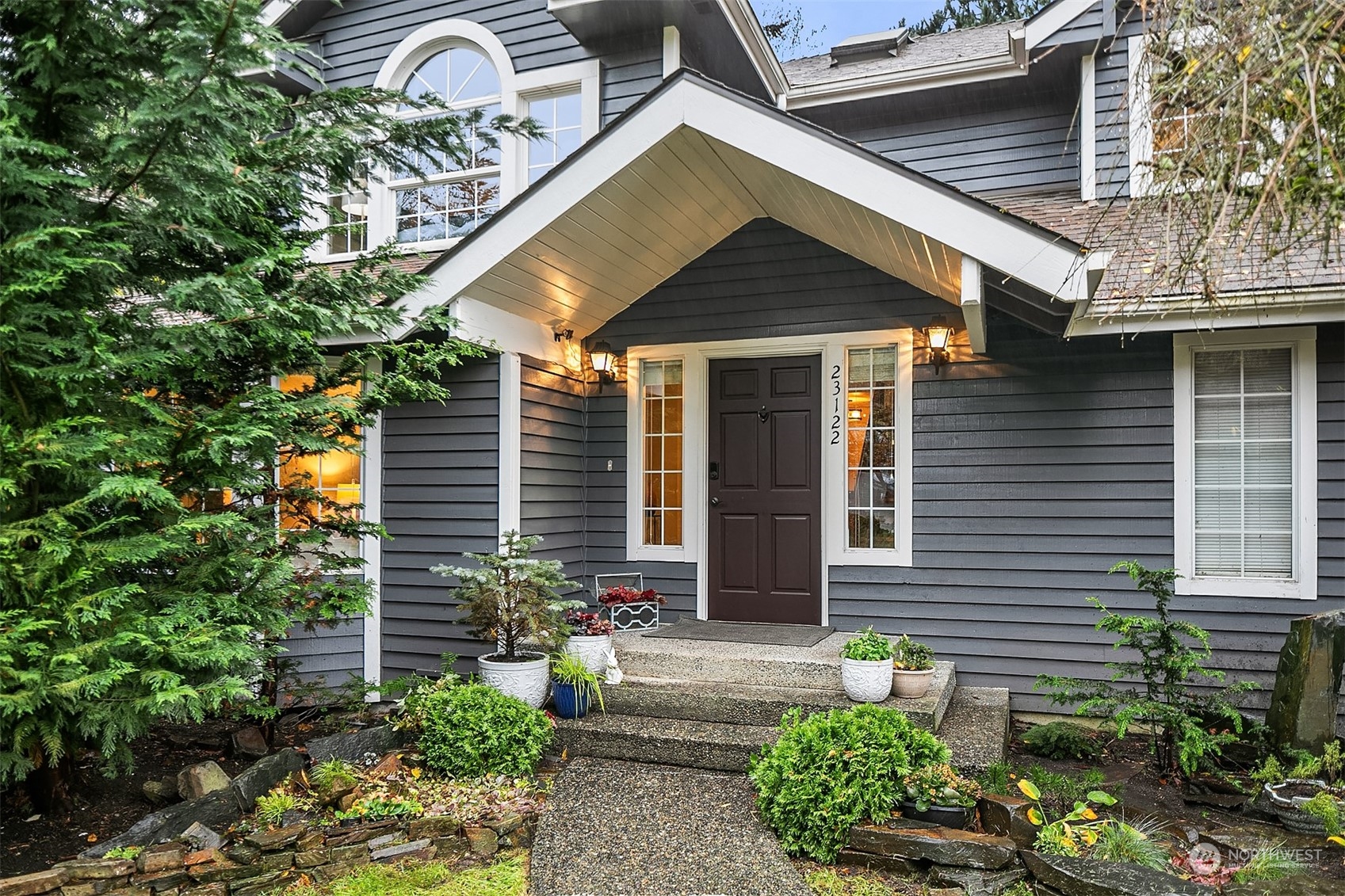 23122 20th Avenue Southeast Bothell, WA 98021 - Photo 7 of 35 a front view of a house with garden
