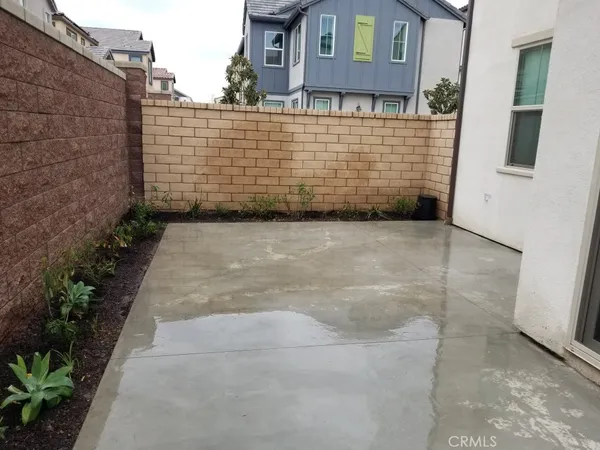 a view of a brick house with many windows