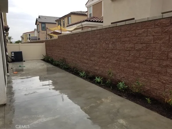 a view of a pathway of a house with a road