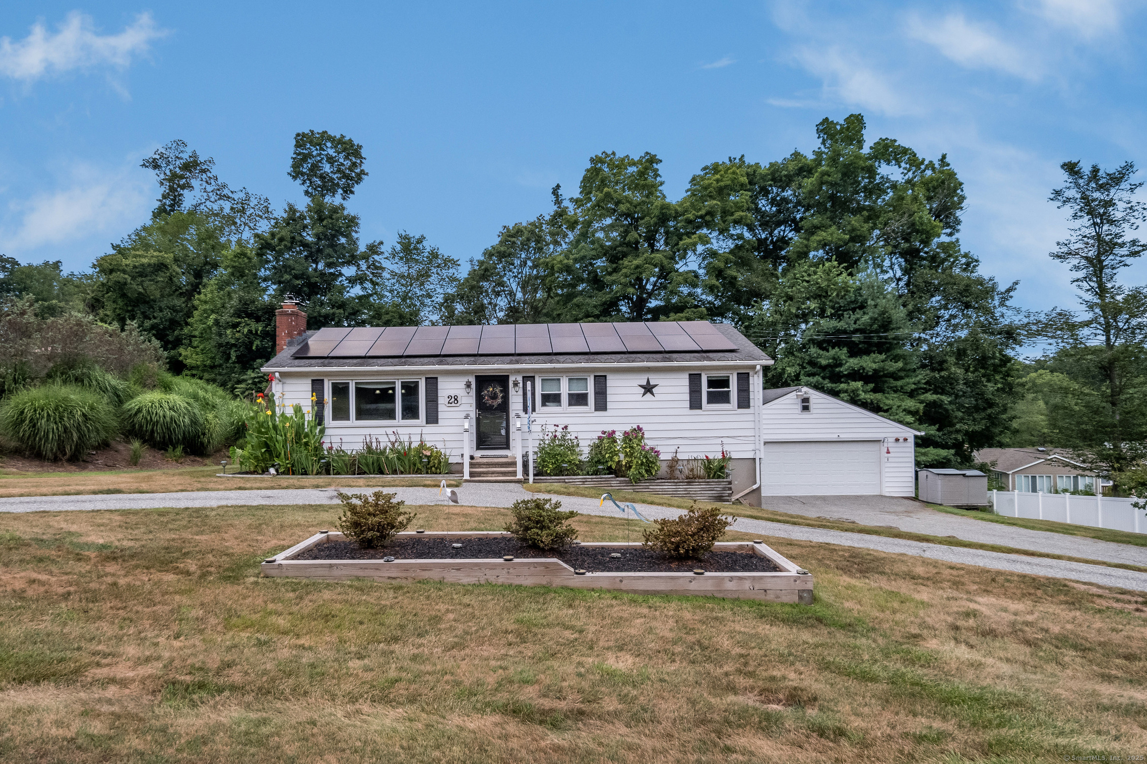 28 Heritage Hill Road Branford, CT 06405 - Photo 1 of 1 a house that has sitting area in front of it