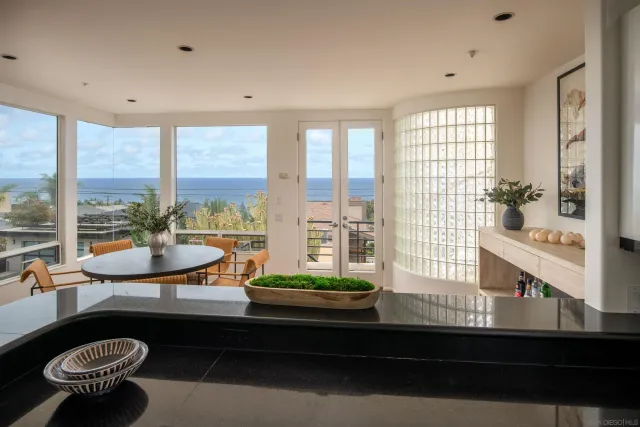 a kitchen with stainless steel appliances granite countertop a stove and a refrigerator