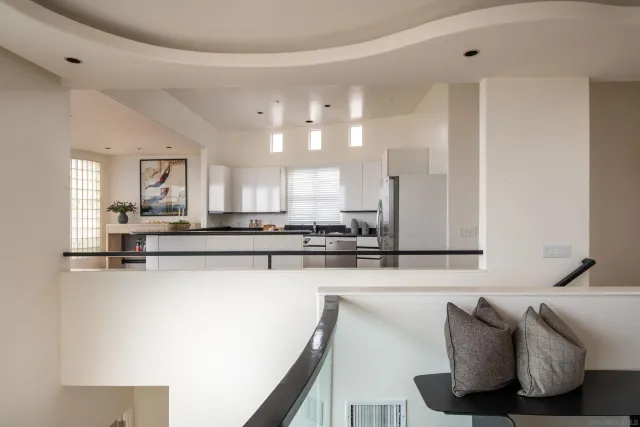 a spacious bedroom with a bed and a fireplace