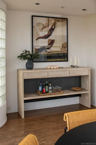 a bedroom with a bed and a potted plant