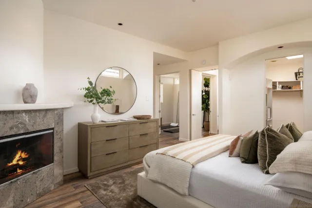 a bathroom with a sink a toilet and a large mirror