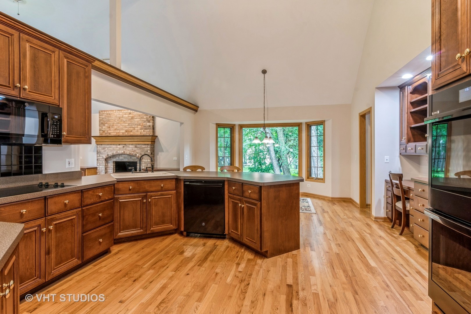 980 Pinecrest Drive Sugar Grove, IL 60554 - Photo 5 of 38 a large kitchen with stainless steel appliances granite countertop a stove a sink dishwasher and a wooden cabinets