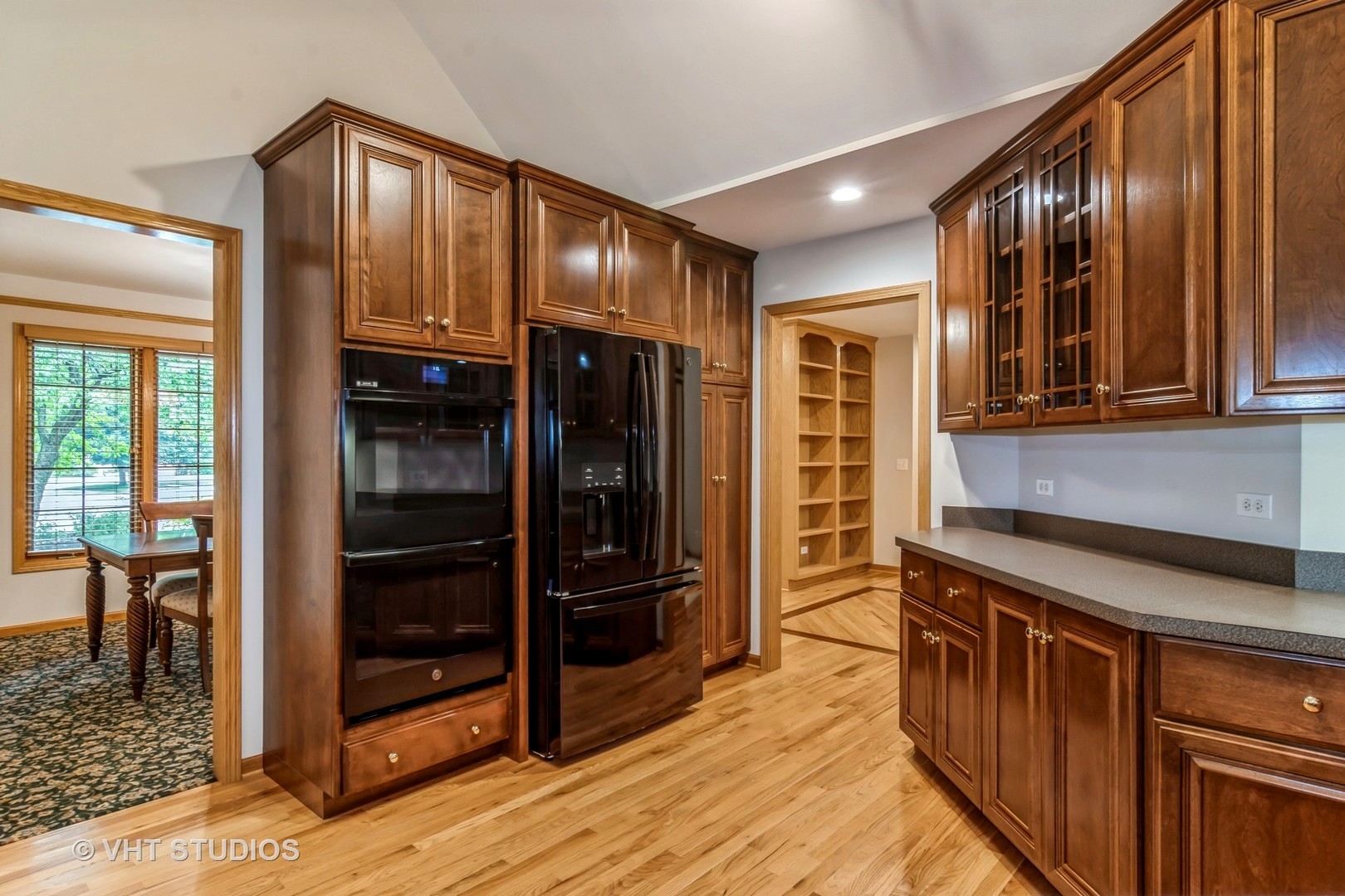 980 Pinecrest Drive Sugar Grove, IL 60554 - Photo 6 of 38 a kitchen with stainless steel appliances granite countertop a refrigerator and wooden cabinets
