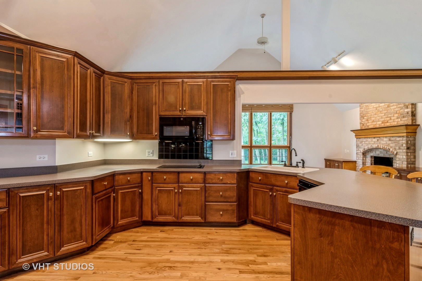 980 Pinecrest Drive Sugar Grove, IL 60554 - Photo 8 of 38 a kitchen with wooden cabinets and sink