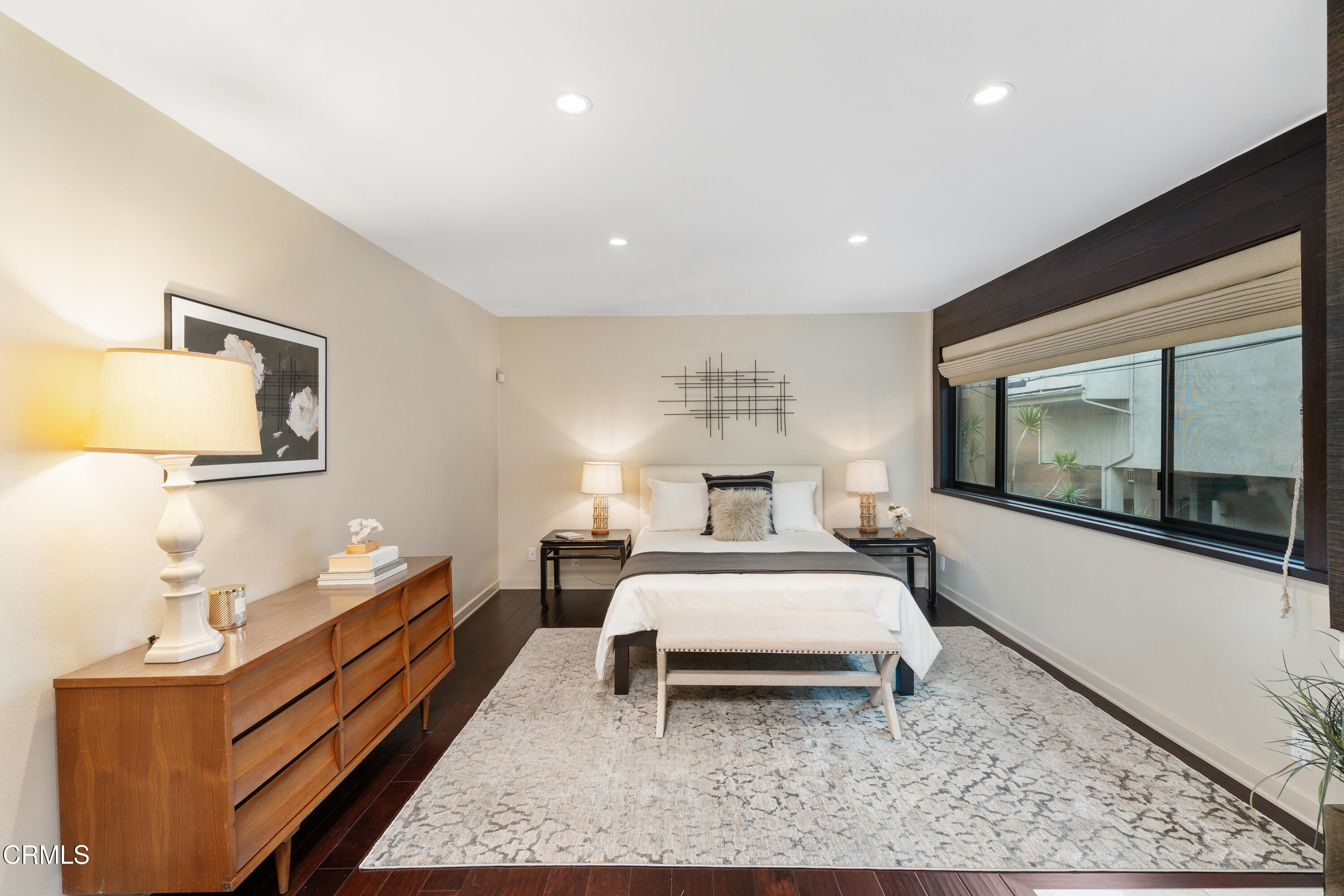 11915 Gorham Avenue, Unit 3 Los Angeles, CA 90049 - Photo 16 of 30 a bed room with a bed and a couch