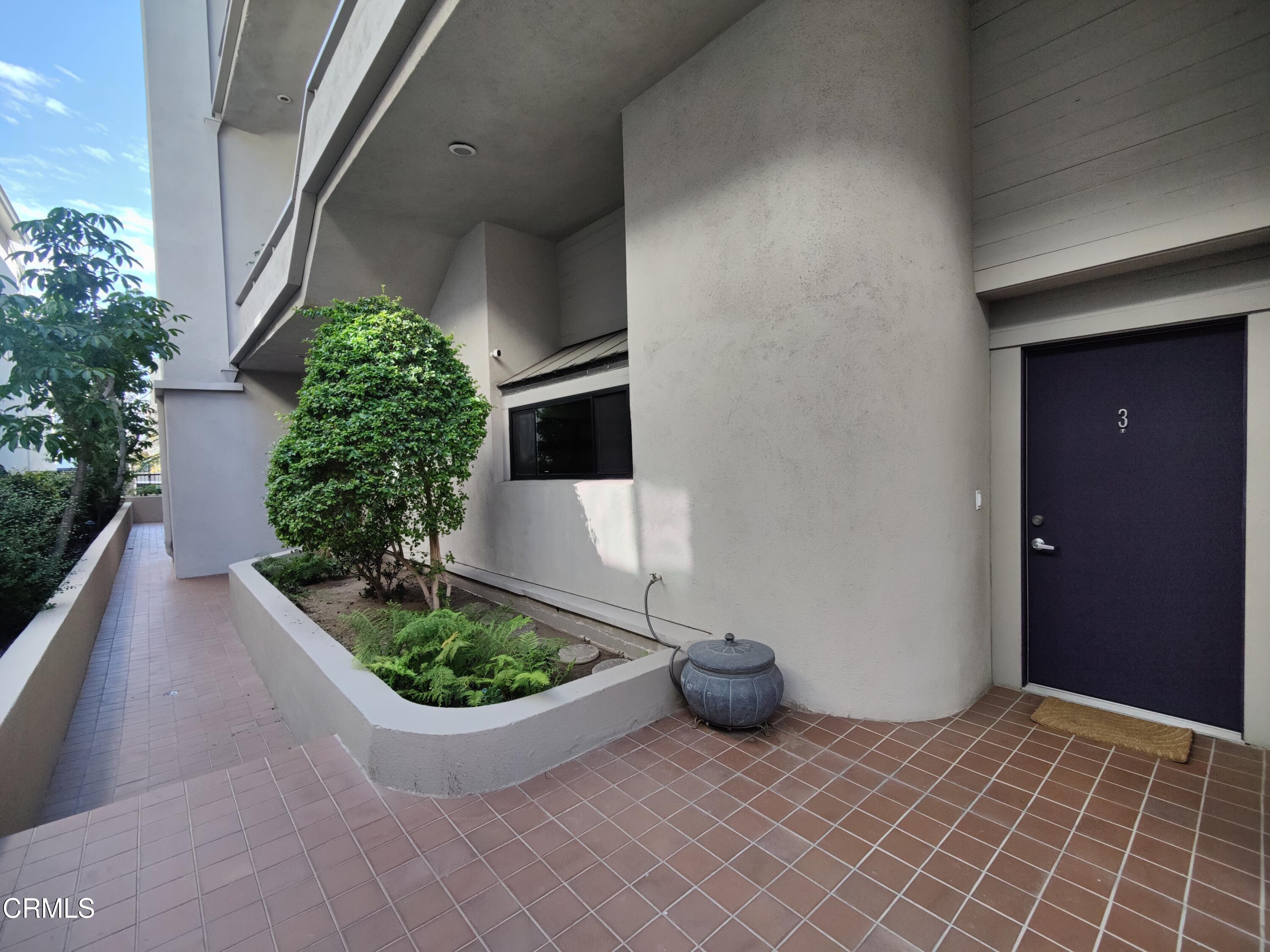 11915 Gorham Avenue, Unit 3 Los Angeles, CA 90049 - Photo 26 of 30 a view of an empty room with potted plants