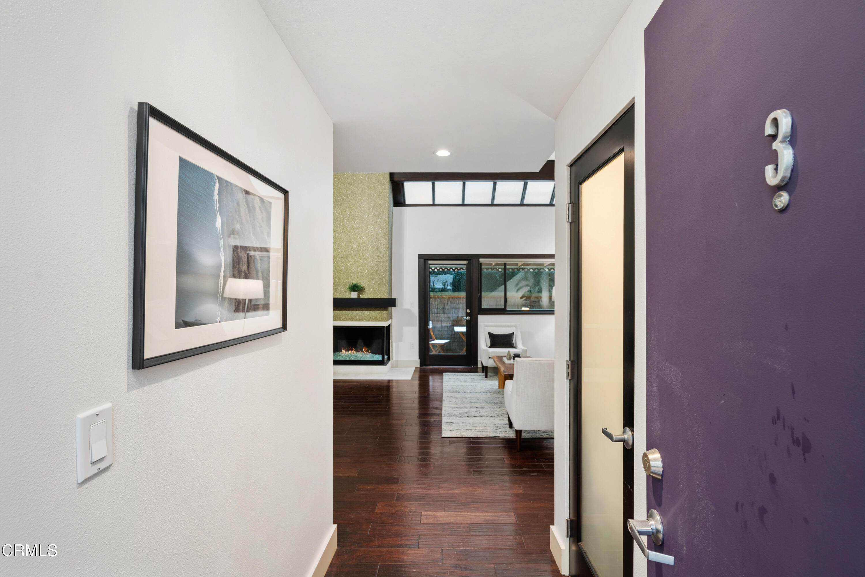 11915 Gorham Avenue, Unit 3 Los Angeles, CA 90049 - Photo 29 of 30 a view of a hallway with wooden floor and a living room