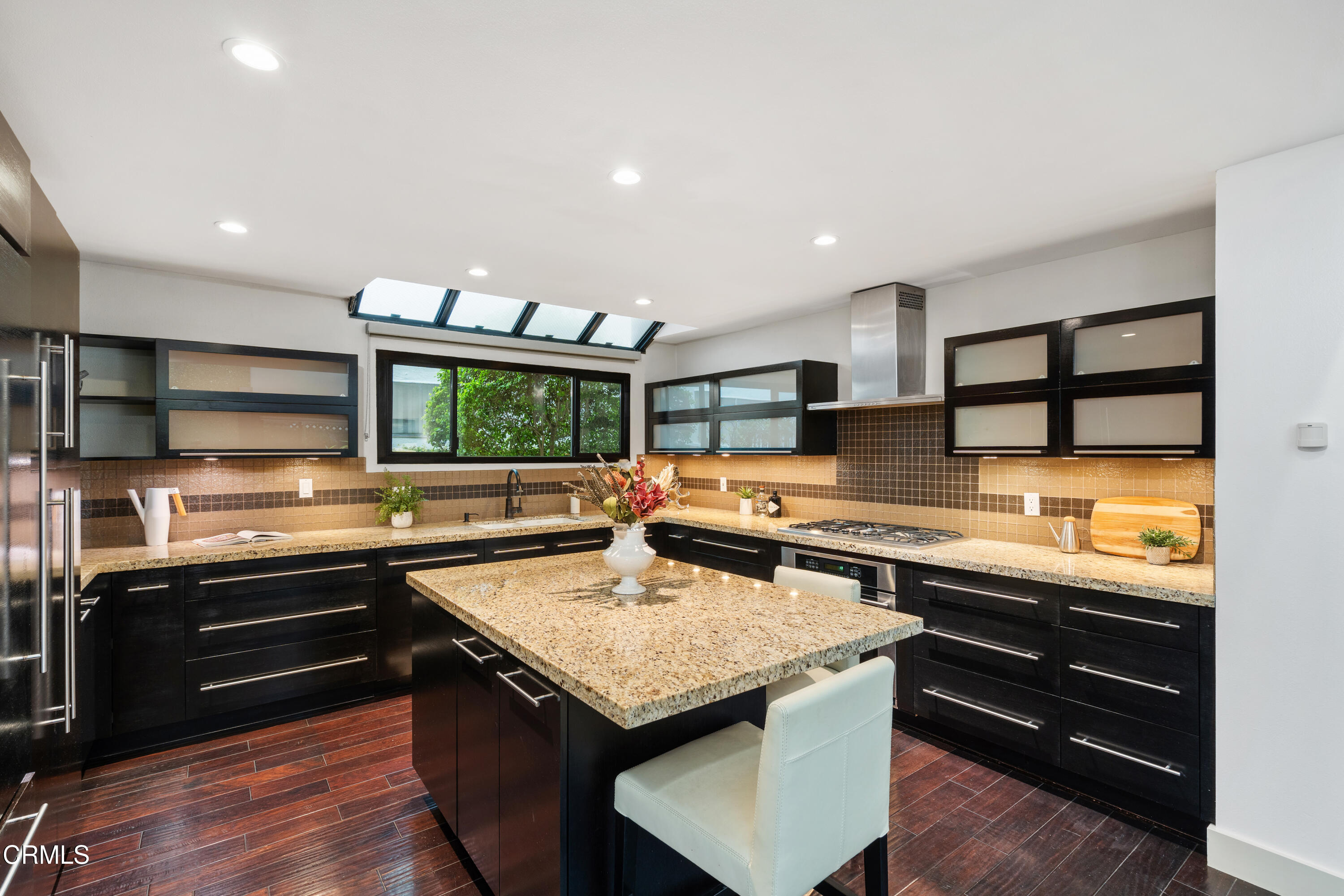 11915 Gorham Avenue, Unit 3 Los Angeles, CA 90049 - Photo 8 of 30 a kitchen with stainless steel appliances granite countertop a stove and a sink