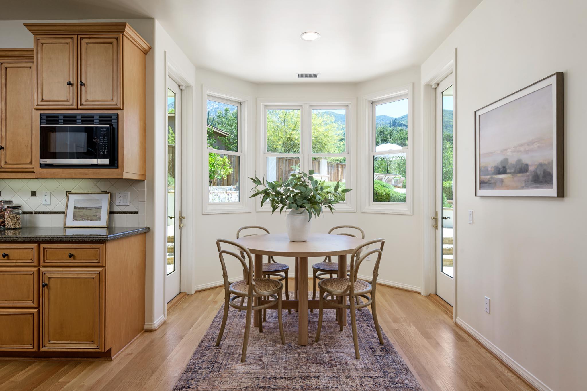 1444 Tunnel Road Santa Barbara, CA 93105 - Photo 12 of 24 a view of a dining room with furniture window and wooden floor