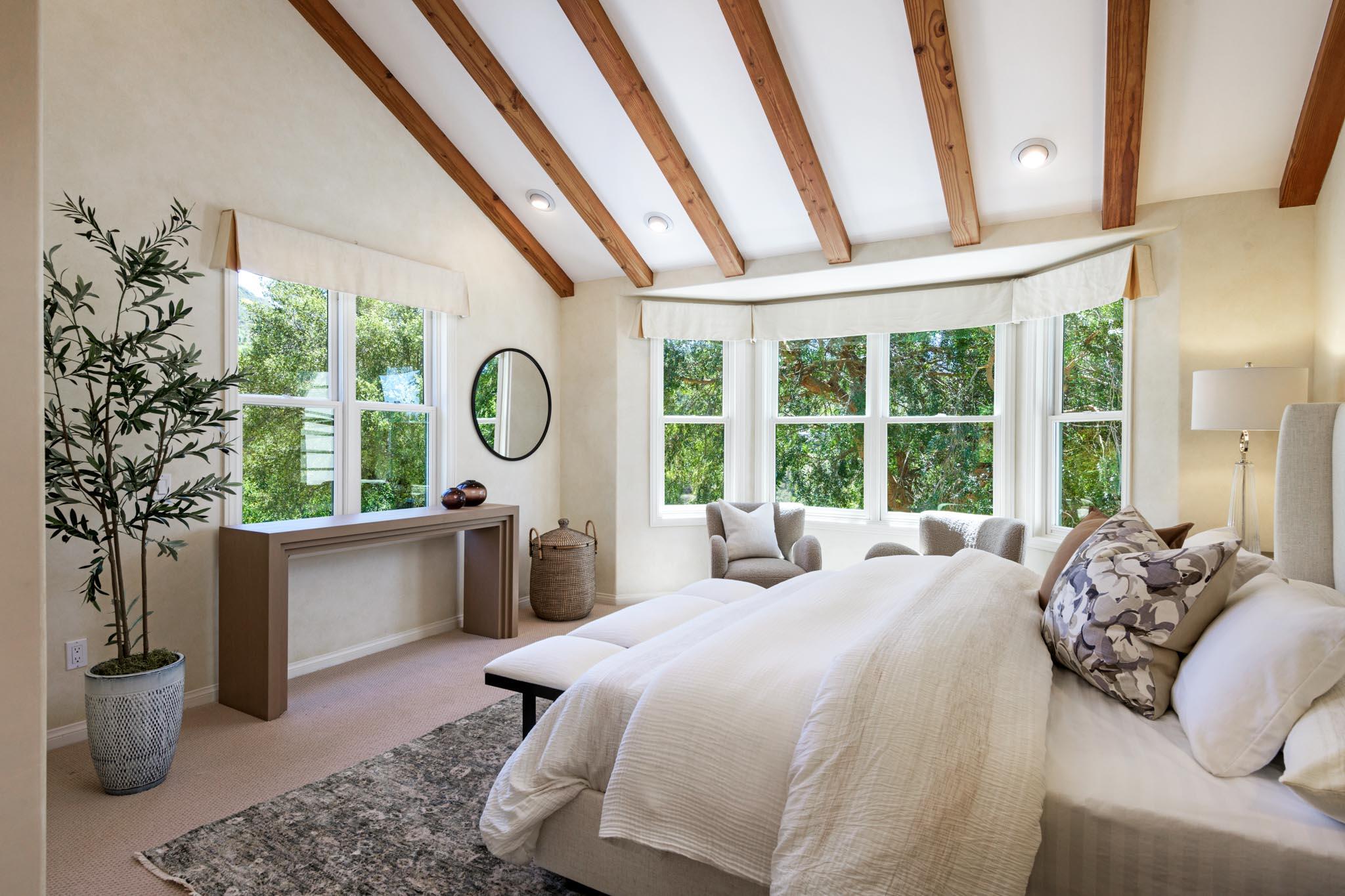 1444 Tunnel Road Santa Barbara, CA 93105 - Photo 13 of 24 a bedroom with a large bed and a large window with outer view