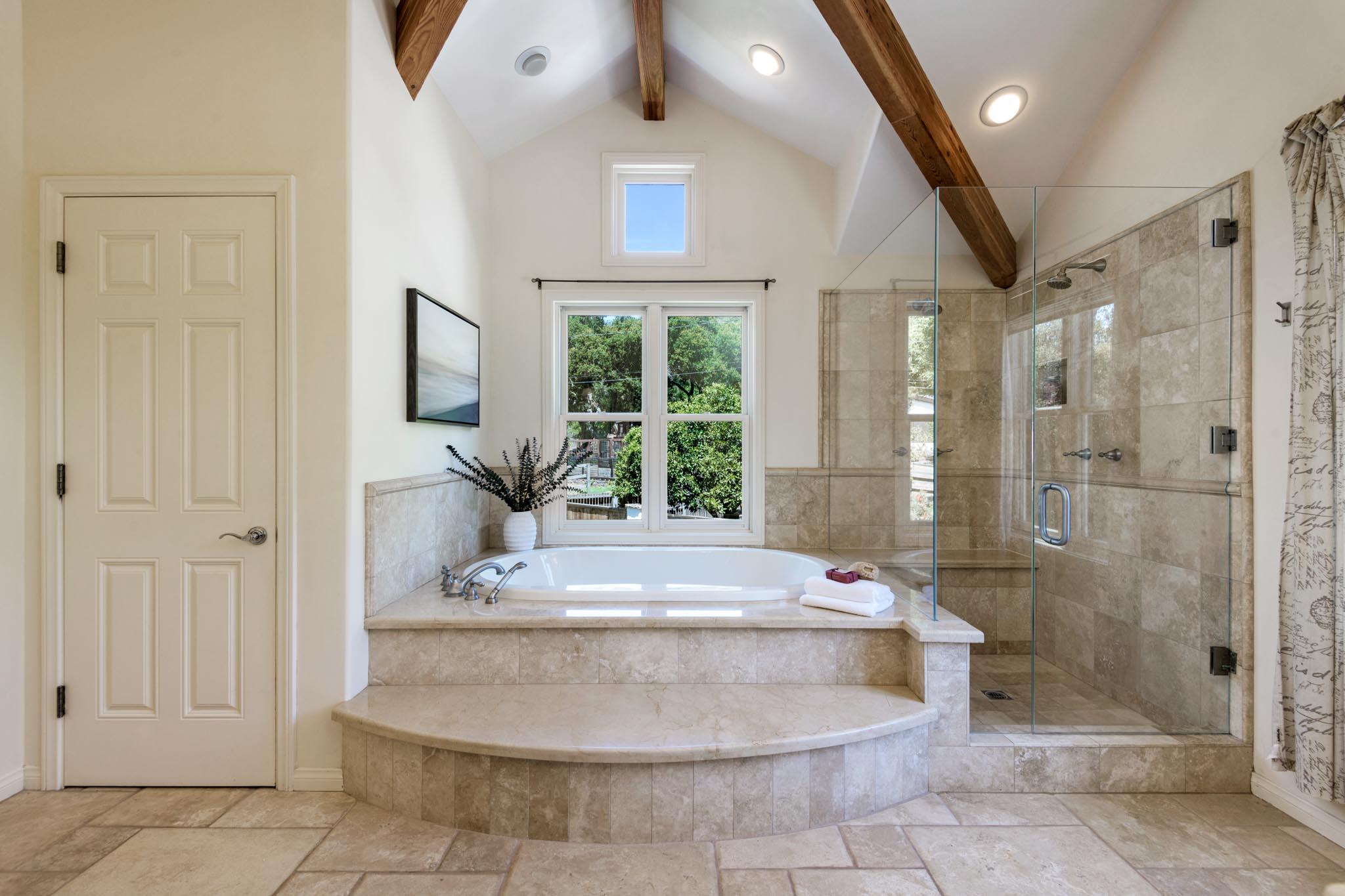 1444 Tunnel Road Santa Barbara, CA 93105 - Photo 15 of 24 a view of a bathroom with a tub shower and checkered floor