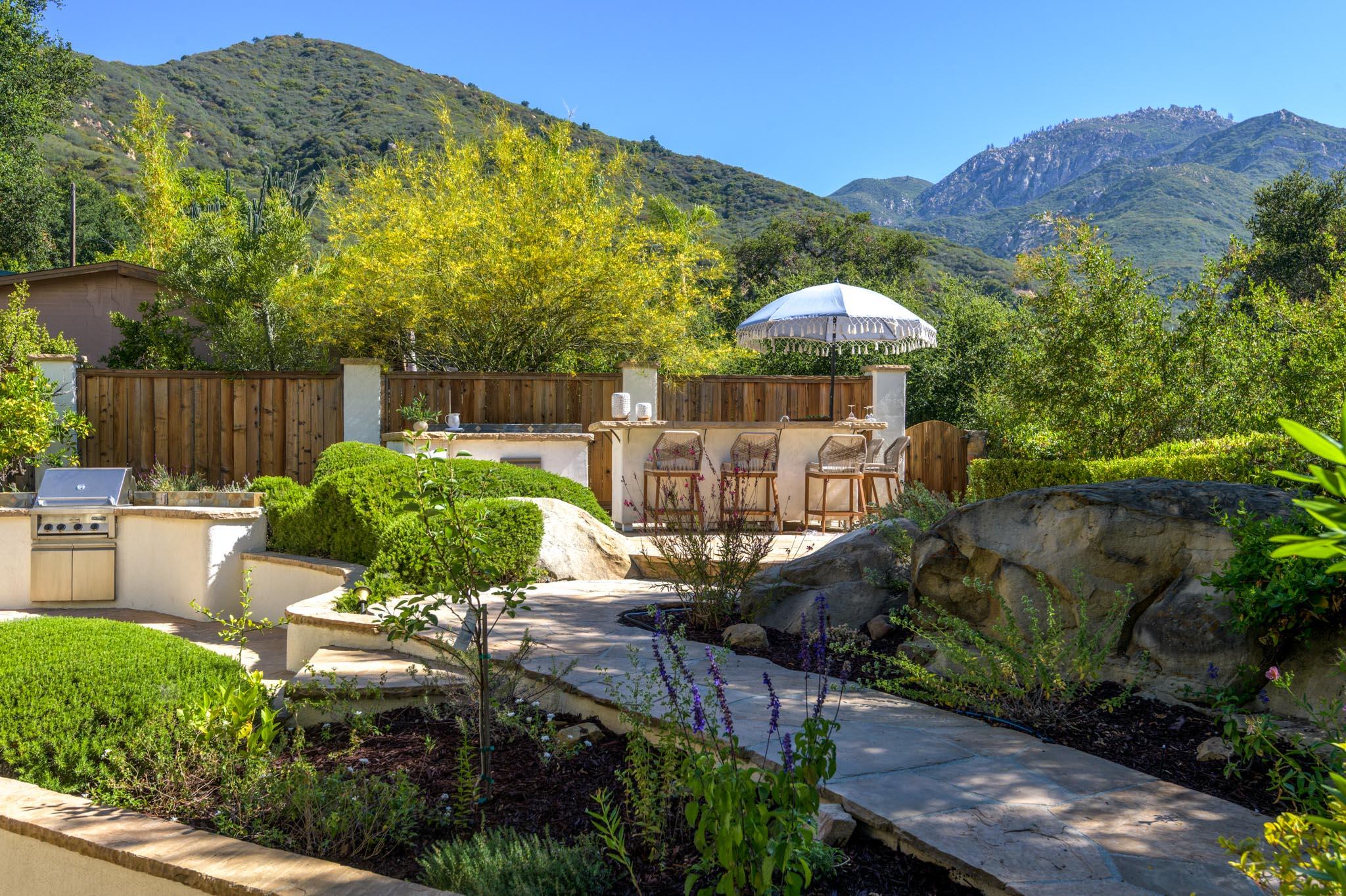 1444 Tunnel Road Santa Barbara, CA 93105 - Photo 17 of 24 a view of a chairs and table under an umbrella in patio