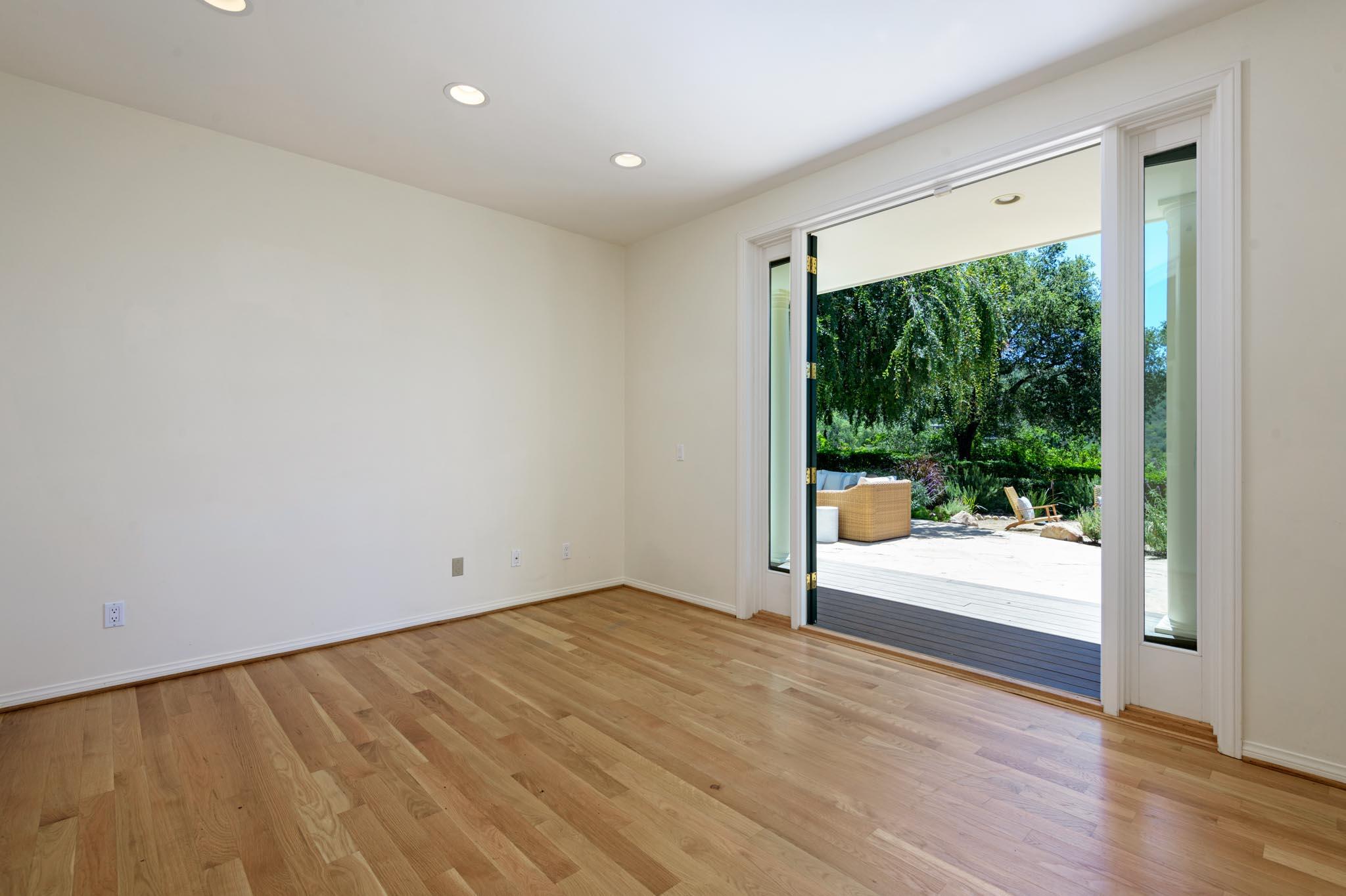 1444 Tunnel Road Santa Barbara, CA 93105 - Photo 22 of 24 a view of empty room with wooden floor and fan