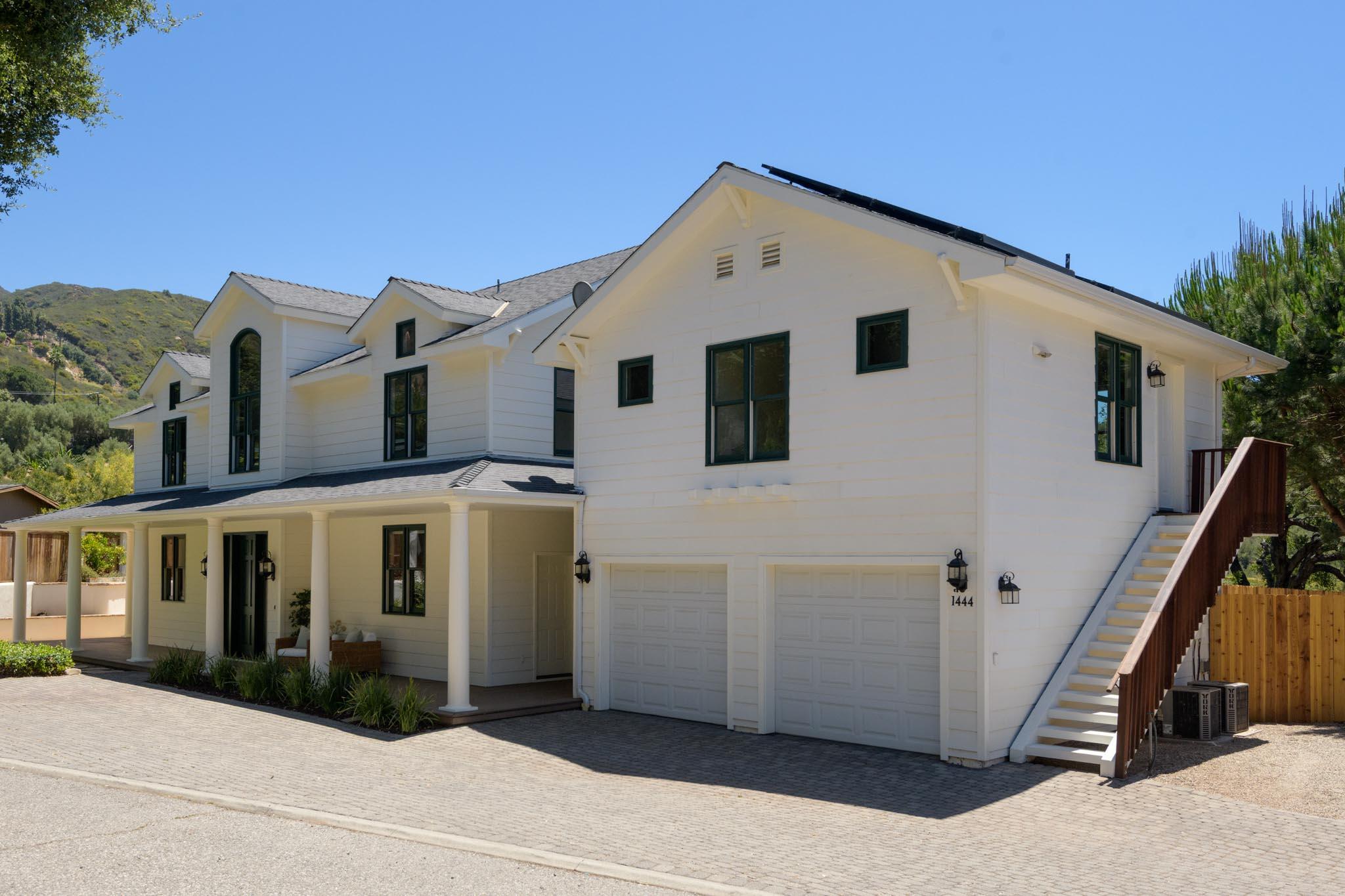 1444 Tunnel Road Santa Barbara, CA 93105 - Photo 24 of 24 a view of a white house with many windows