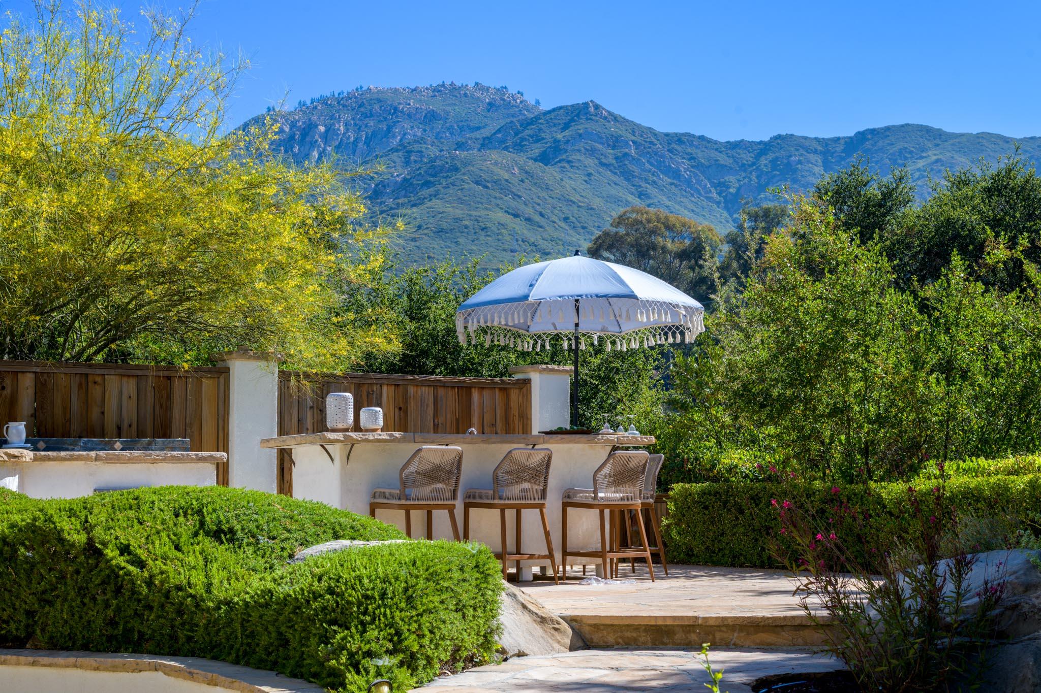 1444 Tunnel Road Santa Barbara, CA 93105 - Photo 4 of 24 a view of a house with backyard and furniture