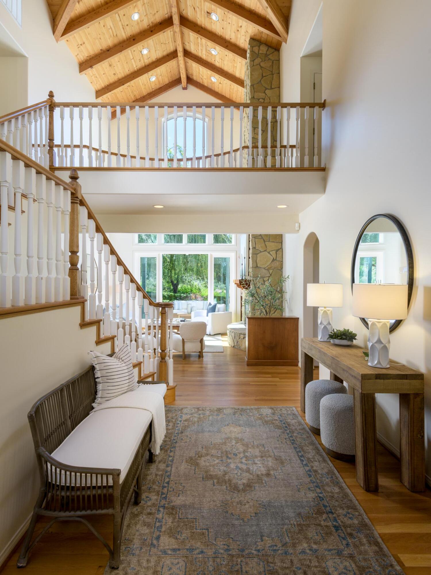1444 Tunnel Road Santa Barbara, CA 93105 - Photo 7 of 24 a living room with furniture a rug and a chandelier