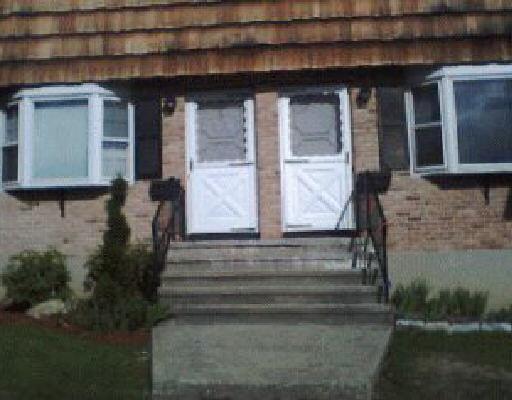 a front view of house with stairs
