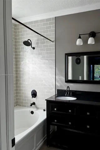 a bathroom with a double vanity sink and a bathtub