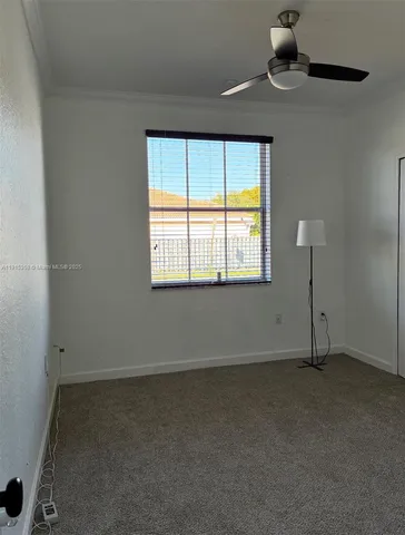 an empty room with a empty space and a window