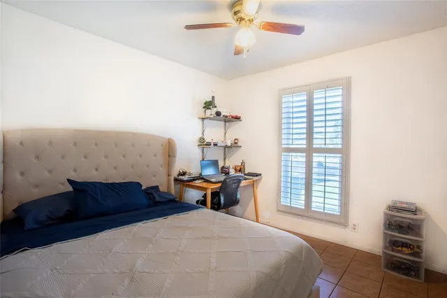 a bedroom with furniture and a window