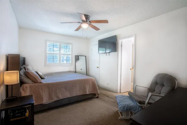 a bedroom with a bed and window