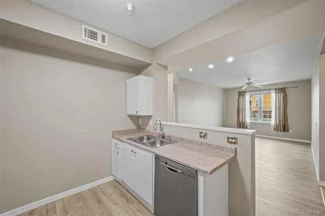 a utility room with sink dryer and washer