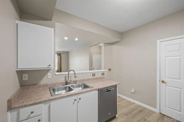 a kitchen with a sink and cabinets