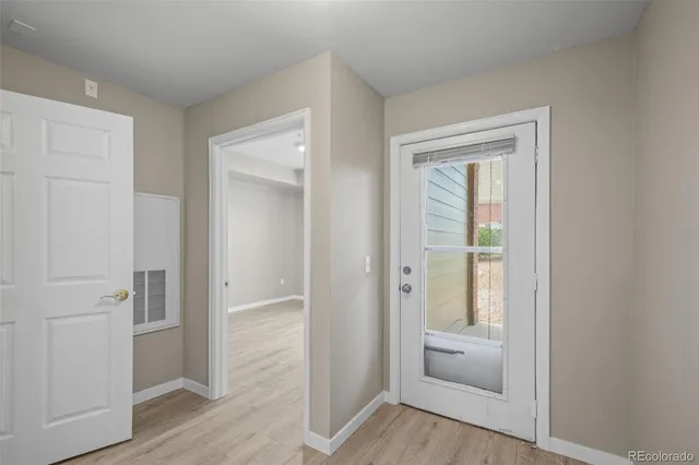 a view of a hallway to a bedroom