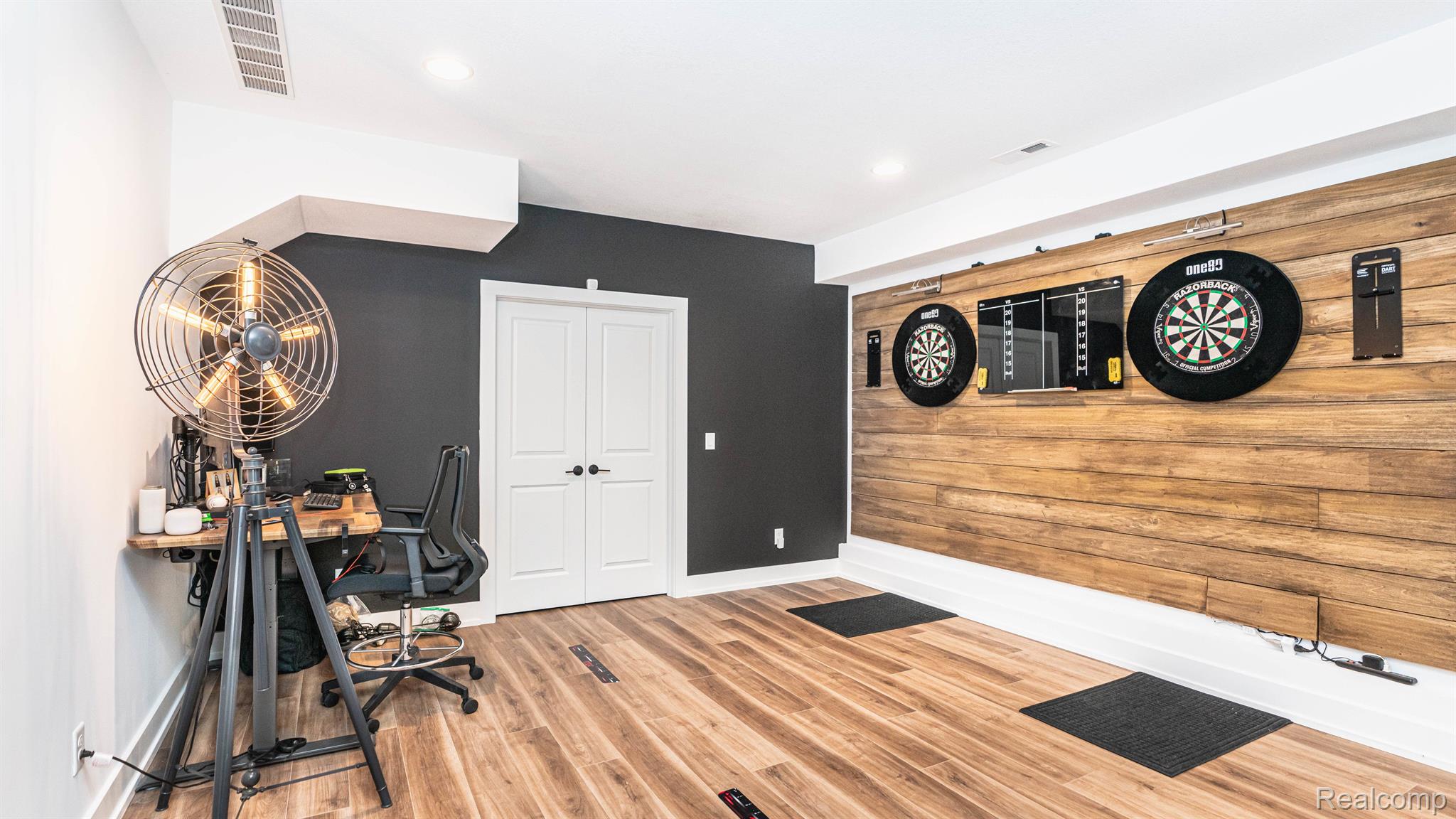 7101 Toma Road Dexter, MI 48130 - Photo 53 of 84 Built-in dart boards with wood plank wall