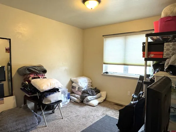 a room with furniture and gym equipment