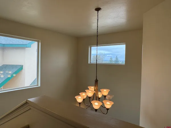 a view of a hallway with a window