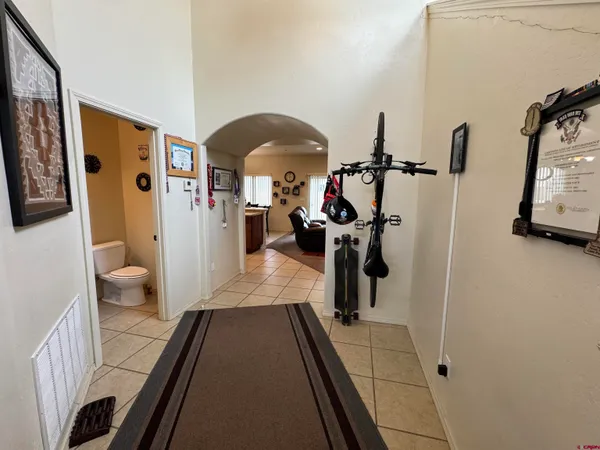 a hallway with a view of living room