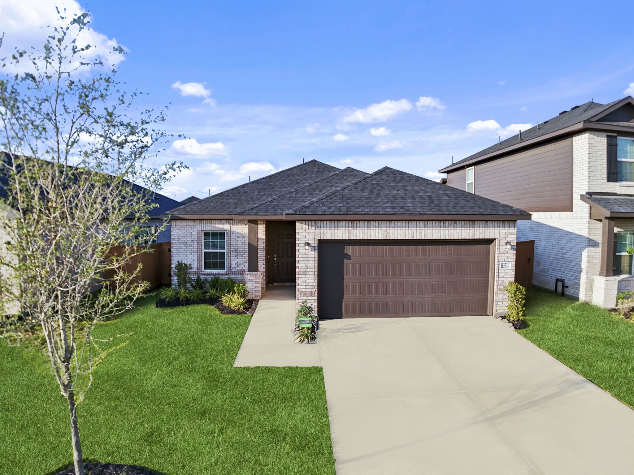 22218 Rome Breeze Drive Hockley, TX 77447 - Photo 23 of 34 A final look at the home’s charming brick elevation showcases its timeless design and welcoming curb appeal. With its inviting entryway and thoughtful details, this property beautifully blends comfort, style, and function.