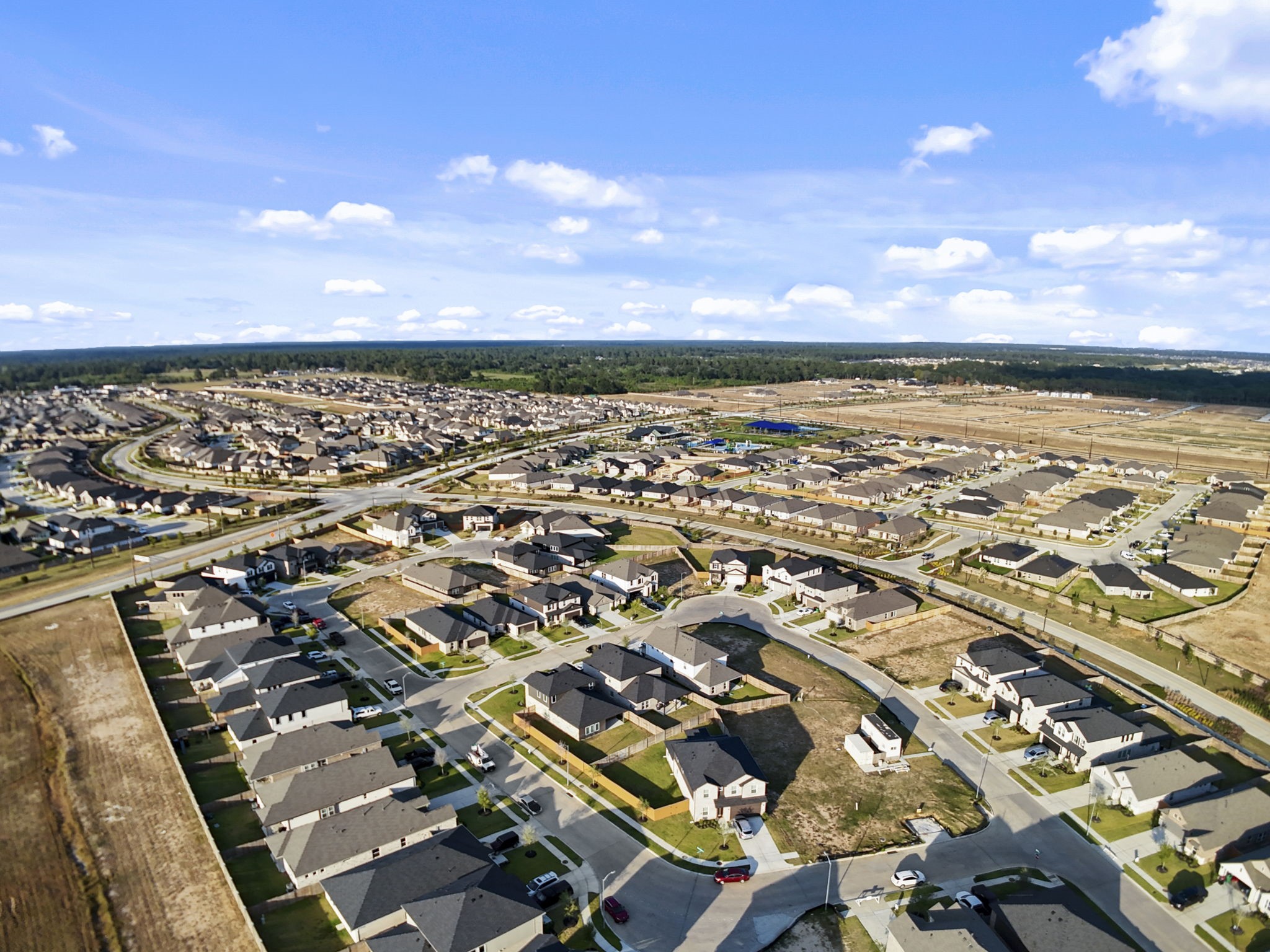 22218 Rome Breeze Drive Hockley, TX 77447 - Photo 25 of 34 Aerial views showcase the master-planned community’s scenic layout, offering convenient access to recreational facilities, walking trails, and beautifully designed homes that make this neighborhood truly special.