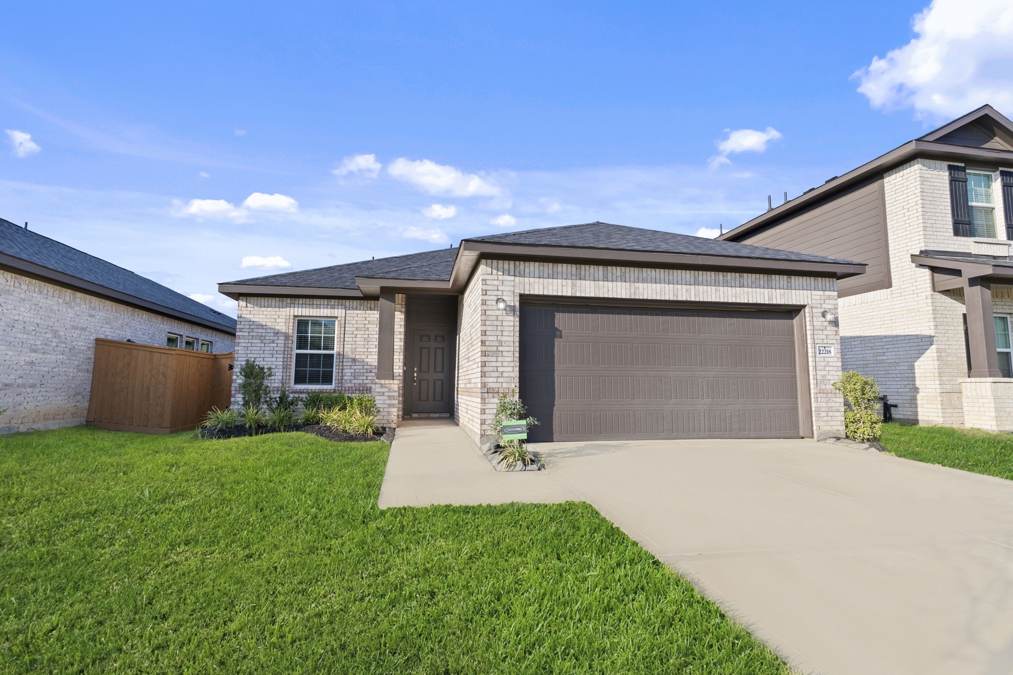 22218 Rome Breeze Drive Hockley, TX 77447 - Photo 3 of 34 A closer look at the all-brick exterior showcases durable craftsmanship and inviting curb appeal. The wide driveway offers plenty of space for parking and leads to a spacious two-car garage. New one-story ranch home by CastleRock Communities Homes! Energy Star Rated with Tankless/On-Demand H2O Heater!