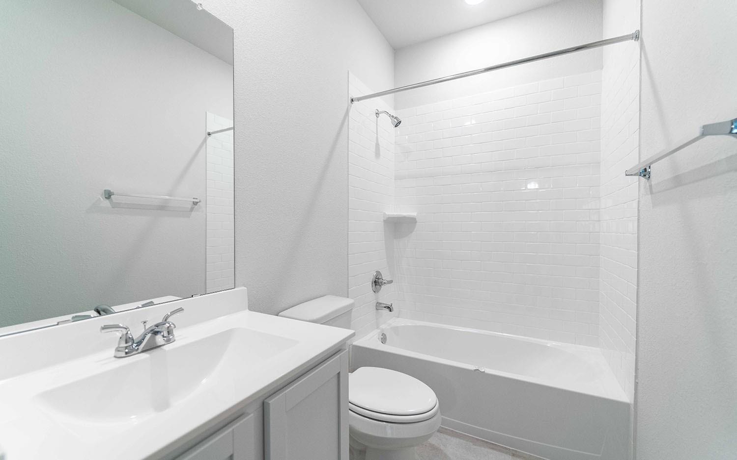 22218 Rome Breeze Drive Hockley, TX 77447 - Photo 10 of 34 The Guest Bathroom has tub and shower combination and more.