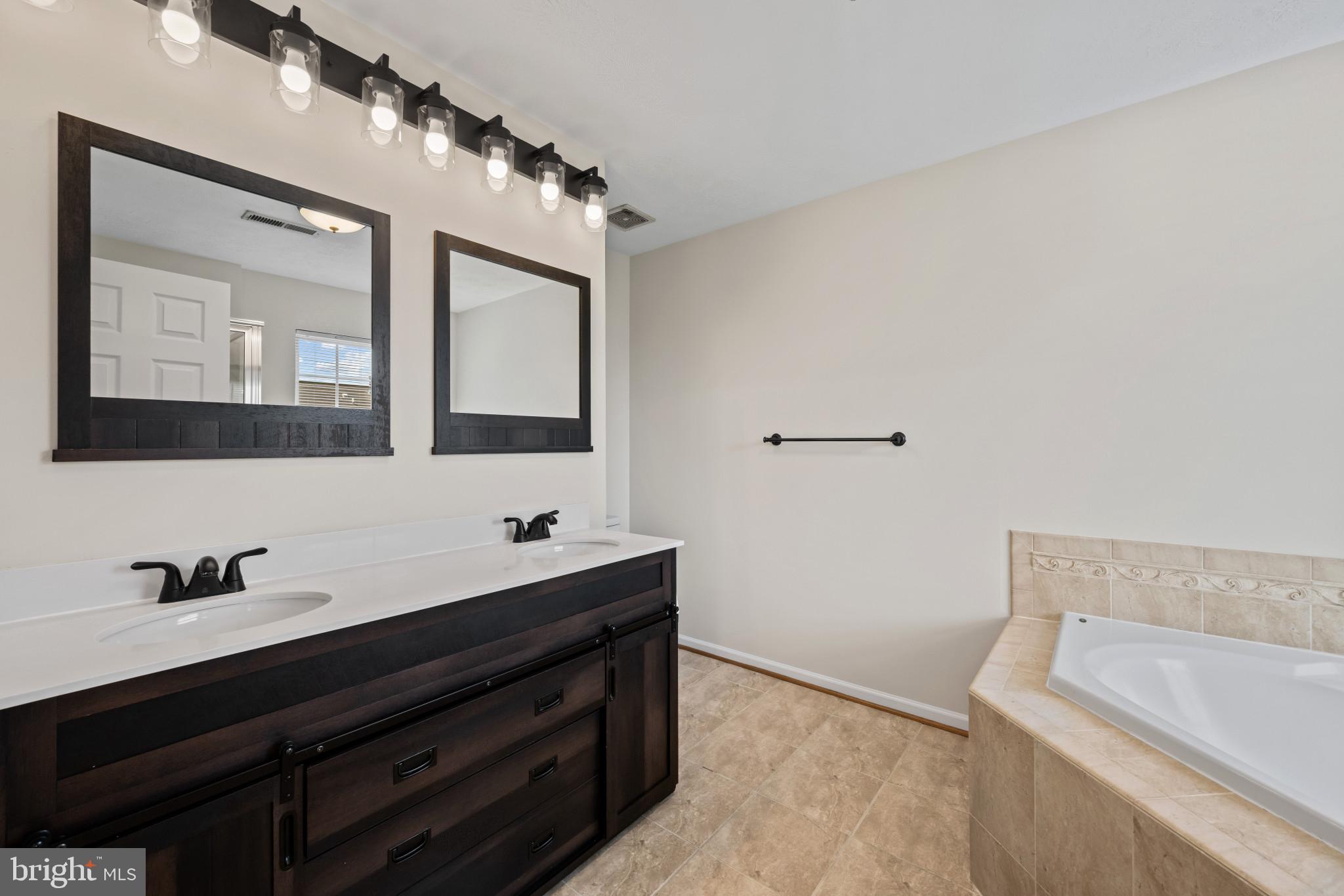9853 Decatur Road Middle River, MD 21220 - Photo 22 of 37 Bathroom featuring a double vanity