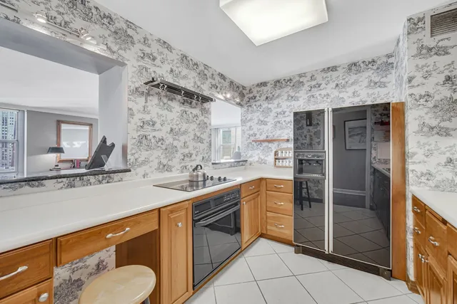 a kitchen with stainless steel appliances a sink stove and refrigerator