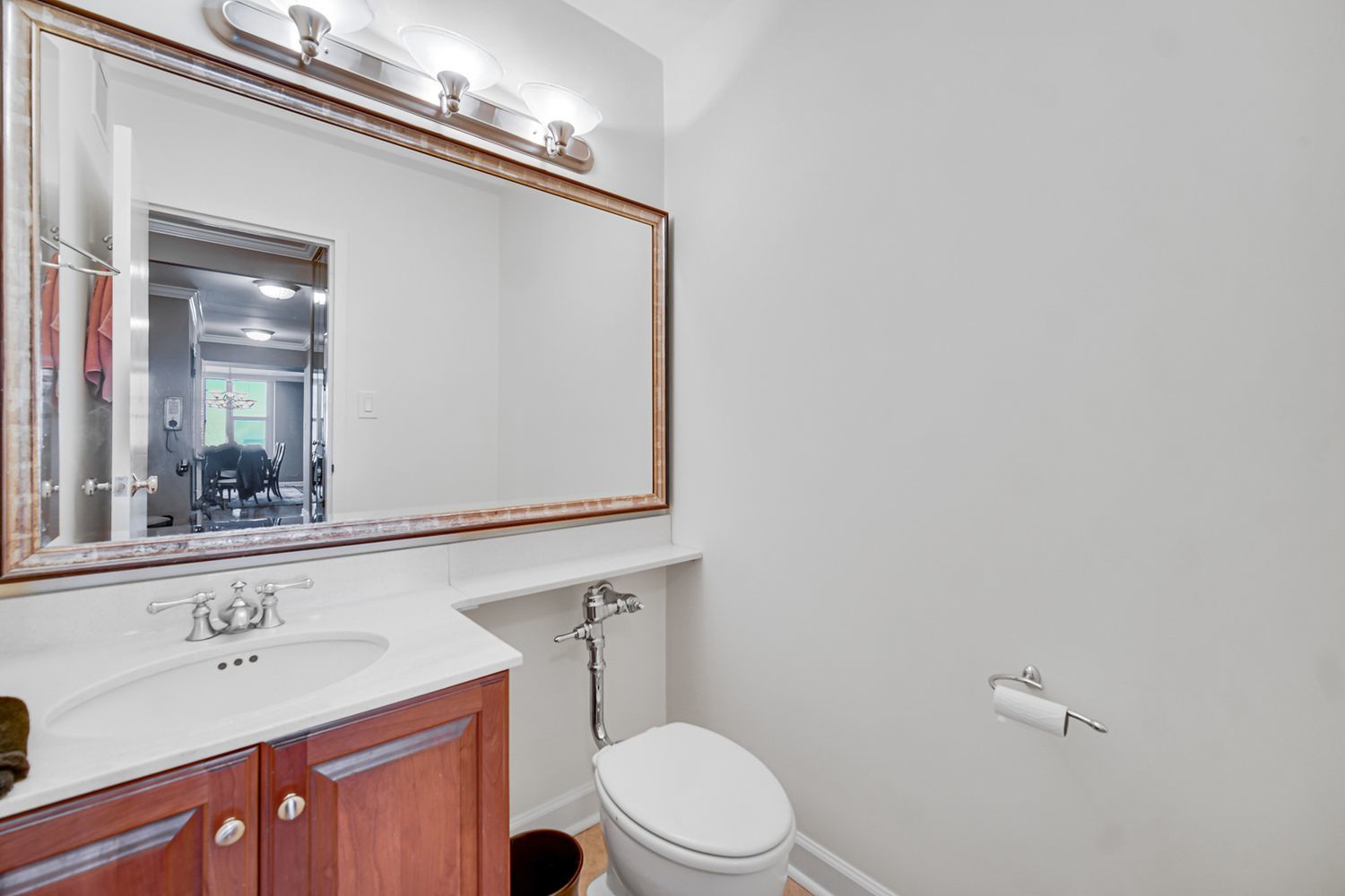 777 North Michigan Avenue, Unit 270002 Chicago, IL 60611 - Photo 23 of 24 a bathroom with a toilet a sink and mirror